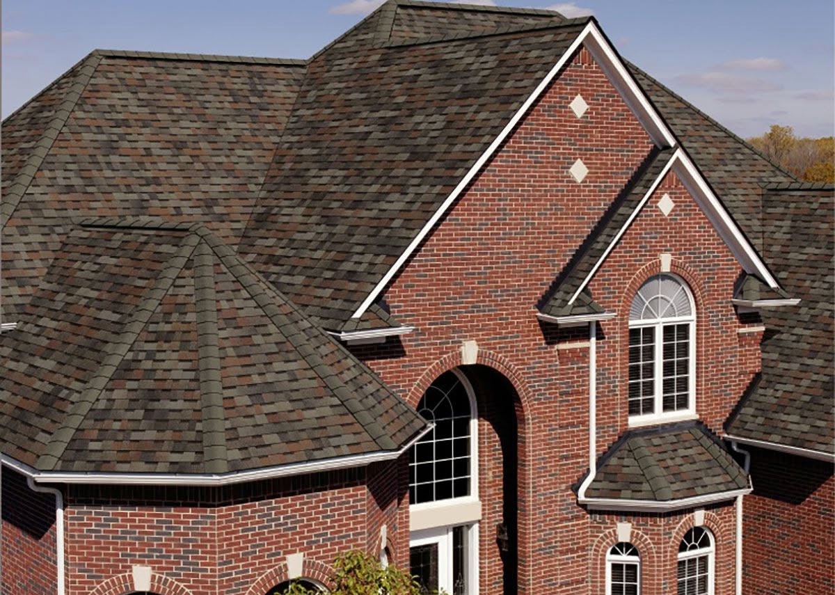 A large brick house with a newly installed roof